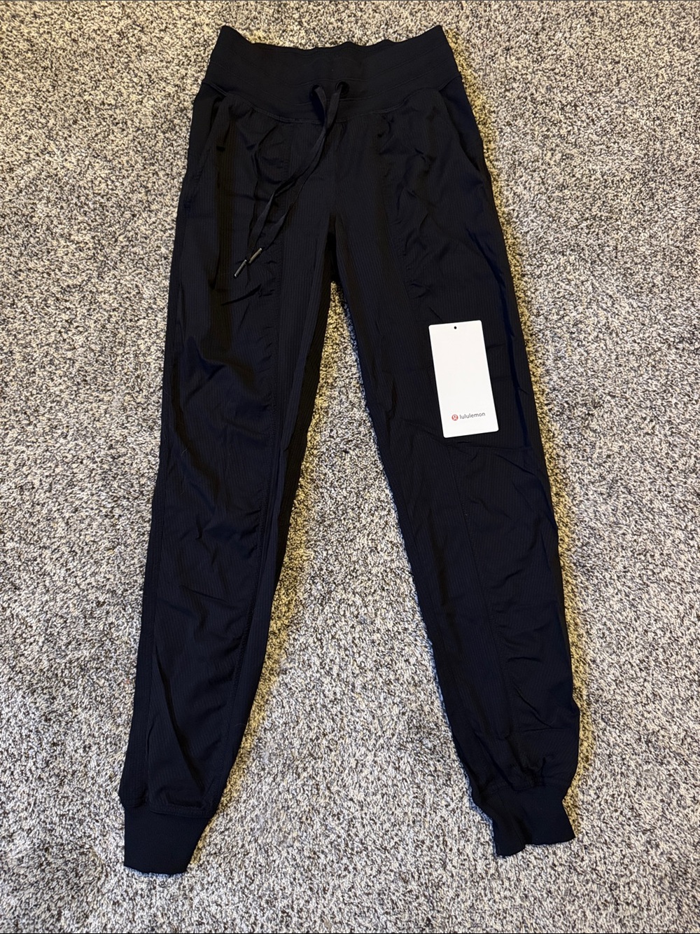 lululemon black activewear pants with logo tag